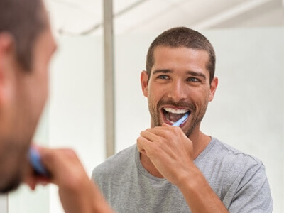 a patient smiling during her implant consultation