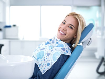 Smiling woman sitting in dental office