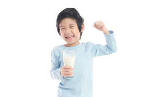 a child smiling and drinking milk